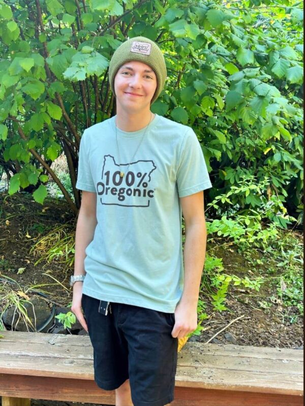 A young man wearing a hat and a t-shirt.