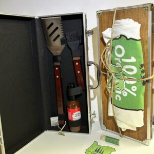A BBQ Gift Set with a bbq utensils and a towel.